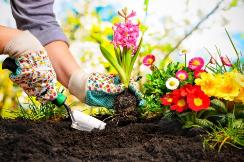 Manual handling of paving materials during a landscaping job